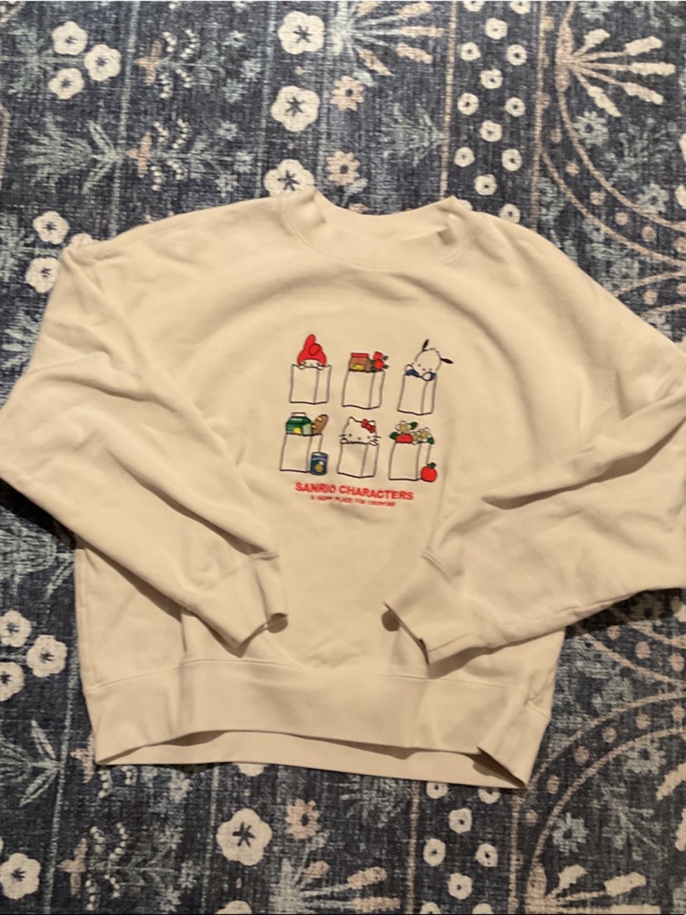 Sanrio Cream Crewneck Sweatshirt with Colorful Character Pockets